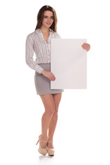 Young happy woman with blank board