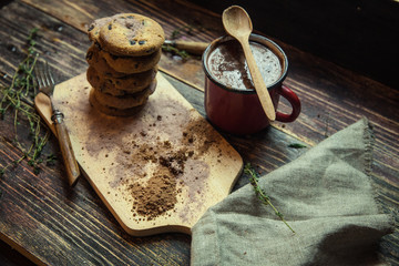 Chocolate chip cookies on plate on grey wooden background