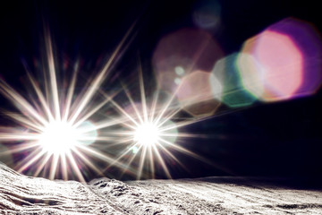 car headlights shine at night