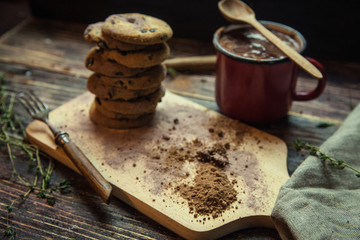 Chocolate chip cookies on plate on grey wooden background
