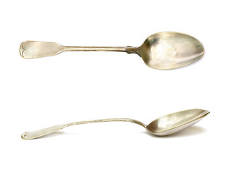Old silver spoons (made in 1924) on white background