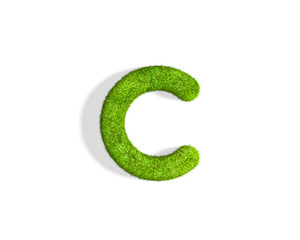 Grass letter C in lowercase format from top angle with shadow on ground.