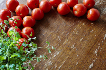 Fototapeta na wymiar fresh tomatoes and oregano in kitchen