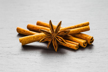 Mulled wine ingredients spices. Anise, cinnamon, cardamom on sto
