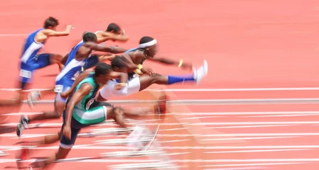 Foto auf Alu-Dibond Jumping over hurdles, motion blur © soupstock