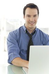 Portrait of a single Caucasian businessman at work in office