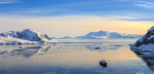 Neco bay surrounded by glaciers and cruise vessel drifting slowl © vadim.nefedov