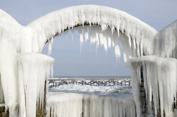 Icy arches from storm in winter on seashore, Bulgaria