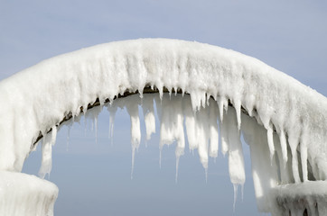 Icy arch from storm in winter on seashore, Bulgaria