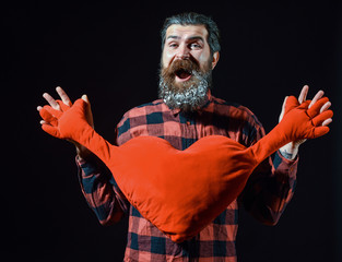 bearded man with heart pillow