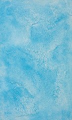 Decorative plaster on the wall, abstract background, imitation of stone