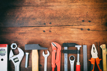 Hand tools on wooden background