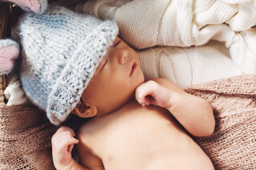 Newborn baby boy in a basket