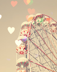 Vintage ferris wheel with heart shaped overlay