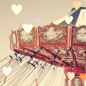 Vintage chain swing ride with heart overlay