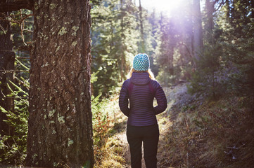 a young woman hiking in the mountains