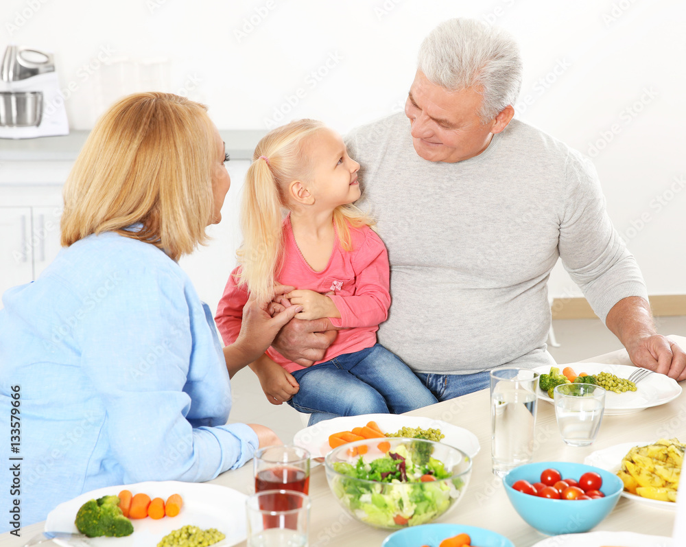 Canvas Prints Happy family having lunch in kitchen