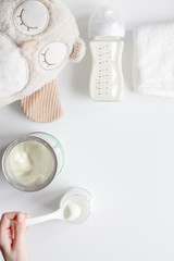 preparation of mixture baby feeding on white background top view