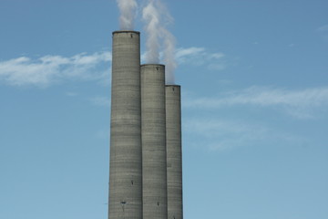 Three puffing smokestacks.