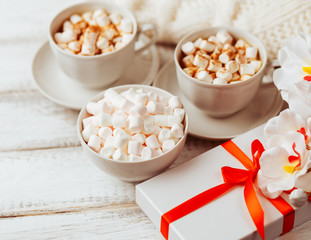 White marshmallow and coffee with milk. Studio Photo.