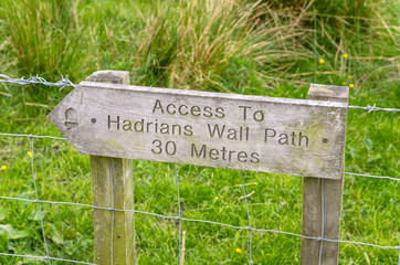 Wooden Direction Sign Pointing to the Access to the Hadrian Wall Path. Northern England.