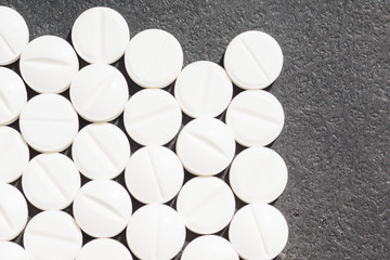 Multiple pills depicting medical treatment or pahrmaceutical ind