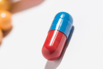 Multiple pills depicting medical treatment or pahrmaceutical ind