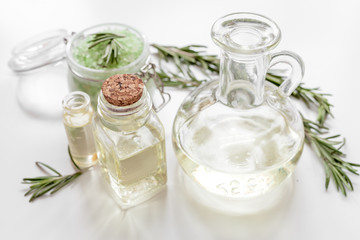organic cosmetics with extracts of herbs rosemary on white background