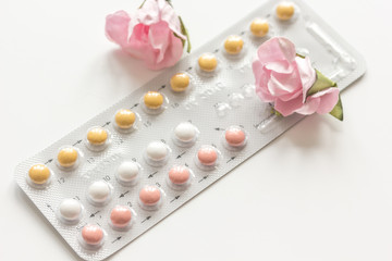concept of female contraception on white background