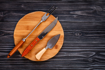 wooden kitchen utensils on dark background top view