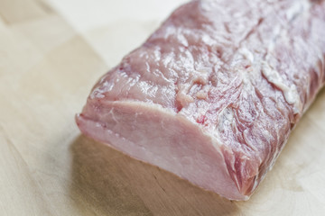 piece of raw pork meat on the table