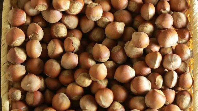 filbert nuts. Placer in a wicker basket, close-up