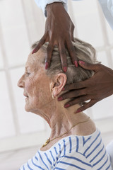  lady having head ans neck massage by therapist