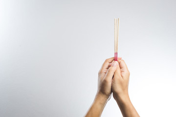 hand with incense stick
