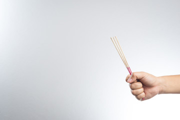 hand with incense stick