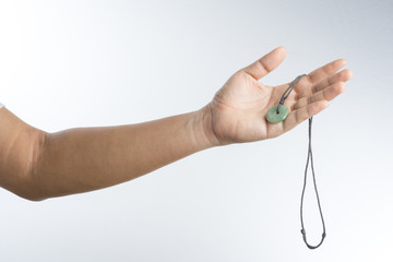 hand with jade necklace