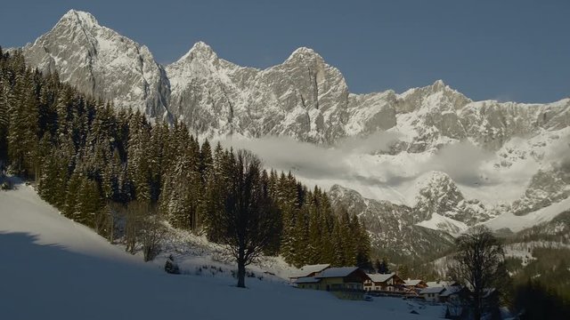 Alpine landscape with the Dachstein and a smal Village,  hiking area, Filsmoos, Alps, Styria, Austria, Europe, Jan 2017