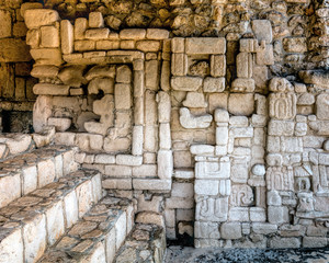 Ancient Mayan wall decorations in one of the rooms of Acropolis in Ek Balam, a late classic Yucatec-Maya archaeological site located in Temozon, Yucatan, Mexico.