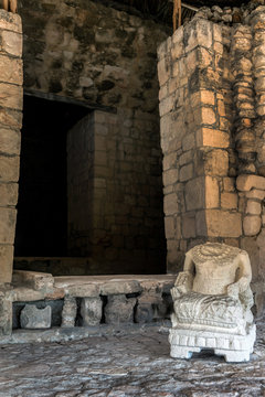 Ancient Mayan statue in one of the rooms of Acropolis in Ek Balam, a late classic Yucatec-Maya archaeological site located in Temozon, Yucatan, Mexico.