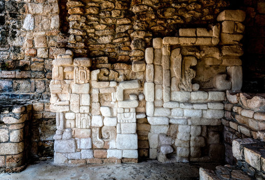 Ancient Mayan wall decorations in one of the rooms of Acropolis in Ek Balam, a late classic Yucatec-Maya archaeological site located in Temozon, Yucatan, Mexico.