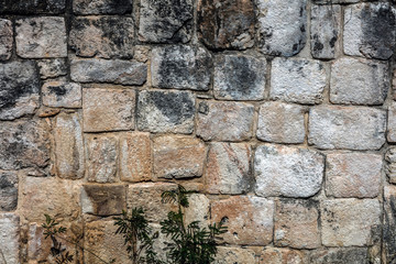 Ancient Mayan stone wall of Ek Balam, a late classic Yucatec-Maya archaeological site located in Temozon, Yucatan, Mexico.