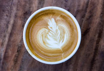 cup of latte coffee on wood table
