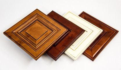 Wooden kitchen cabinet doors made from maple with traditional styles on white surface. Cabinet,...