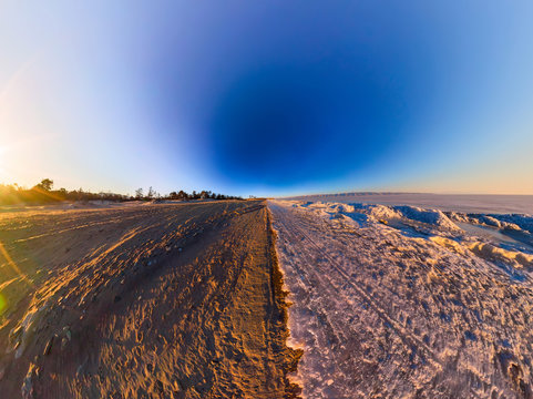 Wide panorama of the border the sandy beach and of Lake Baikal i