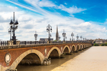 Fototapeta na wymiar Old stony bridge in Bordeaux