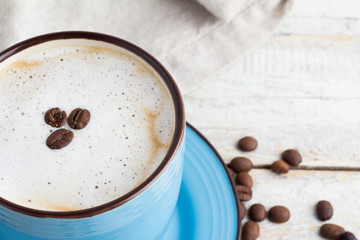 Cappuccino in a blue circle on a white background