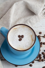 cappuccino and coffee beans top view