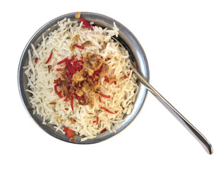 Traditional Indian rice in typical bowl, isolated on white
