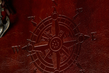 Compass sign on leather cover