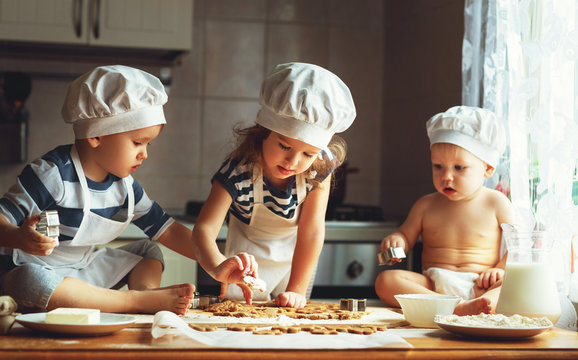 happy family funny kids bake cookies in kitchen
